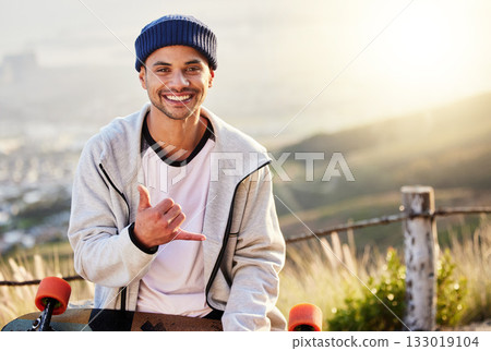 Smile, portrait of skateboarder with shaka hand gesture and skateboarding hobby and skill on mountain. Freedom, fun and face of cool happy gen z man with happiness, longboard or skateboard and sports 133019104