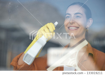 Window cleaning, woman smile and happy maid at home washing windows with glass cleaner. Helping, working and girl with spray for squeegee and house chores and disinfectant doing housekeeping Window cleaning, woman smile and happy maid at home washing windows with glass cleaner. Helping, working and girl with spray for squeegee and house chores and disinfectant doing housekeeping 133019211