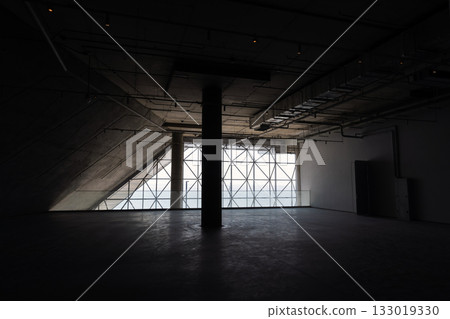 Abstract background photo featuring dark industrial interior with concrete walls 133019330