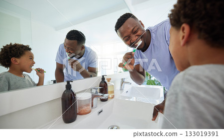 Smile, brushing teeth and father with son in bathroom for dental, morning routine and cleaning. Teaching, self care and toothbrush with black man and child at home for family wellness and hygiene 133019391