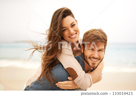 Portrait, piggyback and happy couple hug at beach for travel, romance and freedom together. Face, smile and loving woman playing with man on trip, vacation or holiday, bond or having fun in Mexico Portrait, piggyback and happy couple hug at beach for travel, romance and freedom together. Face, smile and loving woman playing with man on trip, vacation or holiday, bond or having fun in Mexico 133019423