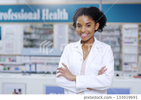 Happy, arms crossed and portrait of black woman in pharmacy for medical, pills and retail. Medicine. healthcare and trust with pharmacist in drug store for product, wellness and expert advice 133019691