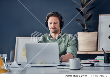 Music headphones, man and architect on laptop in office streaming radio podcast. Computer, audio or male designer listening to sound or song and working on design, research or engineering floor plan 133019807