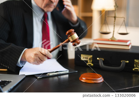 Justice and law concept.Male judge in a courtroom on white table and Counselor or Male lawyer working Justice and law concept.Male judge in a courtroom on white table and Counselor or Male lawyer working 133020006