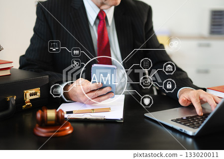 AML Anti Money Laundering Financial Bank Business Concept. judge in a courtroom using laptop and tablet AML Anti Money Laundering Financial Bank Business Concept. judge in a courtroom using laptop and tablet 133020011