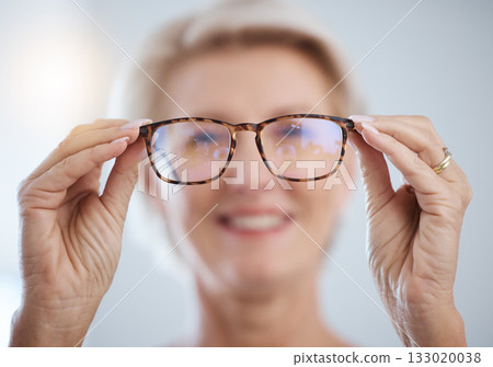 Optometry, vision and senior woman with glasses for eye care, health and wellness in clinic. Healthcare, ophthalmology and portrait of elderly female with spectacles prescription lens in optic store. 133020038
