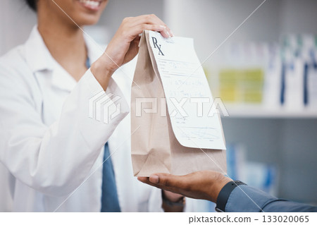 Pharmacy, product and pharmacist giving customer bag for pills prescription, medical supplements and medicine. Healthcare, dispensary and woman help man with medicare package, drugs and medication Pharmacy, product and pharmacist giving customer bag for pills prescription, medical supplements and medicine. Healthcare, dispensary and woman help man with medicare package, drugs and medication 133020065