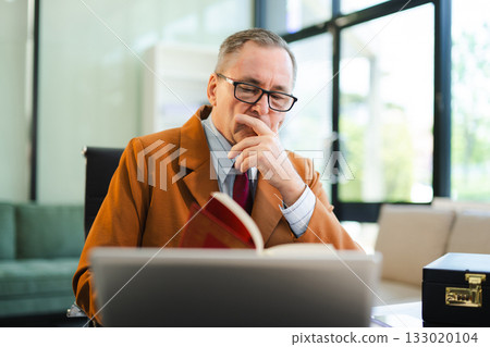 Man lawyer working and gavel, tablet, laptop in front, Advice justice and law concept. Man lawyer working and gavel, tablet, laptop in front, Advice justice and law concept. 133020104