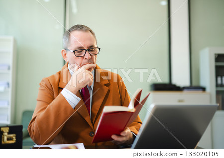 Caucasian male judge in courtroom, lawyer working in office. Perfect for business, legal advice, corporate law 133020105