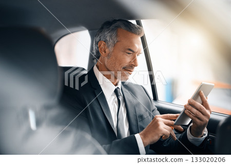 Tablet, business man and car for travel, journey or drive while reading email. Professional male person with tech for communication and internet connection for work with luxury transportation or taxi 133020206