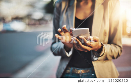Business woman, hands and phone in city networking, social media or texting outdoors. Hand of female professional chatting on mobile smartphone for communication or browsing in street of urban town Business woman, hands and phone in city networking, social media or texting outdoors. Hand of female professional chatting on mobile smartphone for communication or browsing in street of urban town 133020210