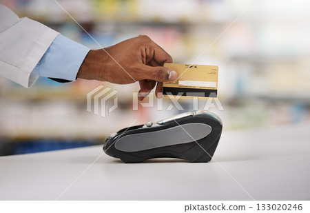 Man, hand and pharmacist with credit card on machine for payment, purchase or swipe in checkout at pharmacy. Hands of person, medical or healthcare expert paying on pos system at pharmaceutical store Man, hand and pharmacist with credit card on machine for payment, purchase or swipe in checkout at pharmacy. Hands of person, medical or healthcare expert paying on pos system at pharmaceutical store 133020246