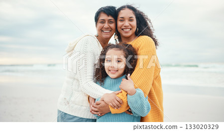 Portrait of grandmother, mom and girl on beach enjoying holiday, travel vacation and weekend together. Happy family, ocean and grandma smile with mother and child for bonding, quality time and love Portrait of grandmother, mom and girl on beach enjoying holiday, travel vacation and weekend together. Happy family, ocean and grandma smile with mother and child for bonding, quality time and love 133020329