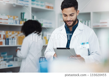 Pharmacy, happy man pharmacist and tablet product management, medicine stock research or online inventory. Digital tech, telehealth service and retail logistics of medical doctor or people in shop 133020455