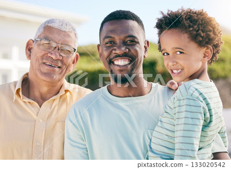Portrait, black family with a man, boy and grandfather bonding outdoor in the garden together for love. Happy, kids or generations with a father, son and senior relative standing outside in the yard 133020542