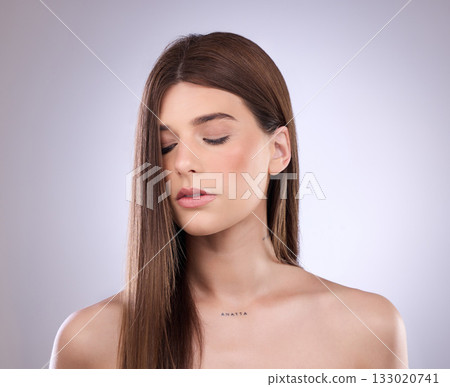 Beauty, face and hair care of woman with eyes closed in studio isolated on a background. Cosmetics, makeup skincare and female model with salon treatment for healthy keratin, balayage and hairstyle. 133020741