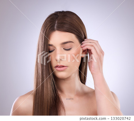 Face, beauty and haircare of woman with straight hair in studio isolated on a background. Natural cosmetics, growth and female model with salon treatment for healthy keratin, balayage or hairstyle. 133020742
