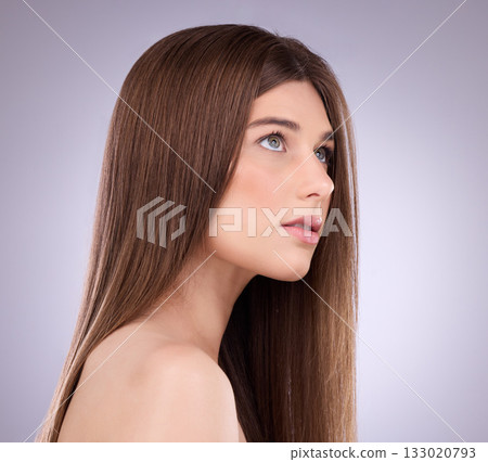 Face, beauty and hair care of a woman in studio isolated on a gray background. Makeup cosmetics, thinking and young female model with salon treatment for healthy keratin, balayage or hairstyle growth 133020793