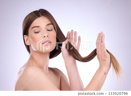 Beauty, long and hair care of woman in studio isolated on a gray background. Face makeup, cosmetics and young female model with salon treatment for healthy keratin, balayage and hairstyle growth. 133020796