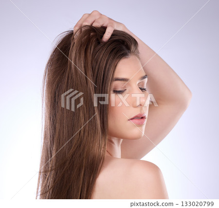Face, beauty and hair care of woman in studio isolated on a gray background. Skincare, makeup cosmetics and female model with salon treatment for healthy keratin, balayage or natural hairstyle growth Face, beauty and hair care of woman in studio isolated on a gray background. Skincare, makeup cosmetics and female model with salon treatment for healthy keratin, balayage or natural hairstyle growth 133020799