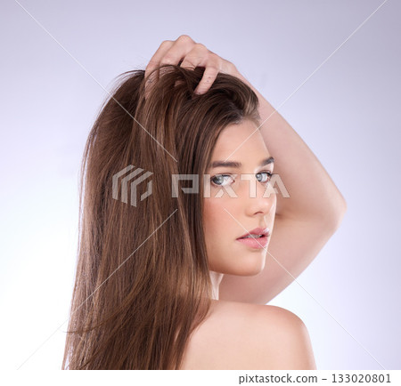 Face portrait, beauty and hair care of woman in studio isolated on a gray background. Skincare, makeup cosmetics or female model with salon treatment for healthy keratin, balayage or hairstyle growth Face portrait, beauty and hair care of woman in studio isolated on a gray background. Skincare, makeup cosmetics or female model with salon treatment for healthy keratin, balayage or hairstyle growth 133020801