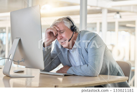 Call center, customer support and headache with a consultant man suffering from pain while working in the office. Crm, service and burnout with a senior male telemarketing working feeling stress Call center, customer support and headache with a consultant man suffering from pain while working in the office. Crm, service and burnout with a senior male telemarketing working feeling stress 133021181
