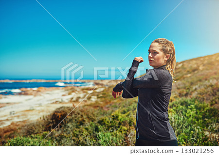 Woman at beach, stretching arms with fitness and health, young athlete workout outdoor with focus and blue sky. Active female person in nature, warm up by ocean and exercise with mockup space Woman at beach, stretching arms with fitness and health, young athlete workout outdoor with focus and blue sky. Active female person in nature, warm up by ocean and exercise with mockup space 133021256