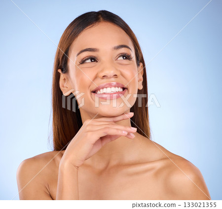 Skincare, beauty and cosmetics, face of hispanic woman, smile and skin glow promo on blue background. Makeup, facial product placement and model in studio for dermatology spa promotion with mockup. Skincare, beauty and cosmetics, face of hispanic woman, smile and skin glow promo on blue background. Makeup, facial product placement and model in studio for dermatology spa promotion with mockup. 133021355