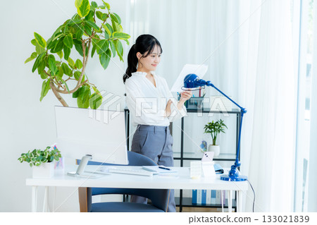 Businesswoman with document Businesswoman with document 133021839