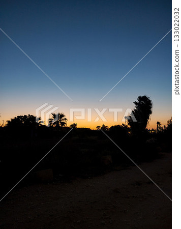 Experience the serene beauty of a Sunset Landscape with captivating silhouettes Experience the serene beauty of a Sunset Landscape with captivating silhouettes 133022032