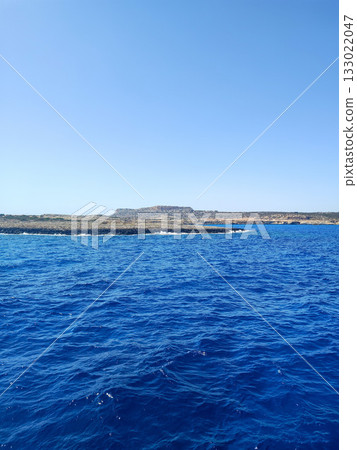 A Serene Coastal View Under Clear Blue Skies, Perfect for Relaxation and Adventure 133022047