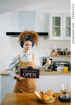 Startup successful small business owner sme woman stand with tablet in cafe restaurant. woman barista cafe owner. Startup successful small business owner sme woman stand with tablet in cafe restaurant. woman barista cafe owner. 133022212