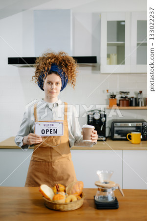 Startup successful small business owner sme woman stand with tablet in cafe restaurant. woman barista cafe owner. Startup successful small business owner sme woman stand with tablet in cafe restaurant. woman barista cafe owner. 133022237