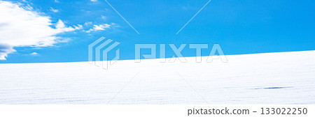 A simple winter landscape of blue skies, clouds, and snowy fields seen in Biei, Hokkaido A simple winter landscape of blue skies, clouds, and snowy fields seen in Biei, Hokkaido 133022250