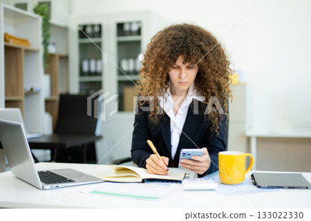business expert attractive smiling young woman holding digital tablet on desk in creative office. business expert attractive smiling young woman holding digital tablet on desk in creative office. 133022330