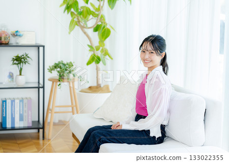 Young woman relaxing in the living room 133022355