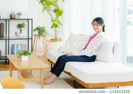 Young woman relaxing in the living room 133022356