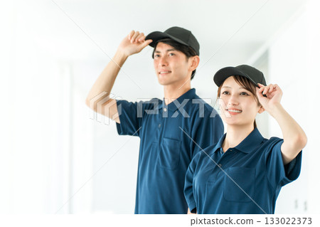 Male and female staff of transportation and delivery companies wearing polo shirt uniforms, drivers Male and female staff of transportation and delivery companies wearing polo shirt uniforms, drivers 133022373