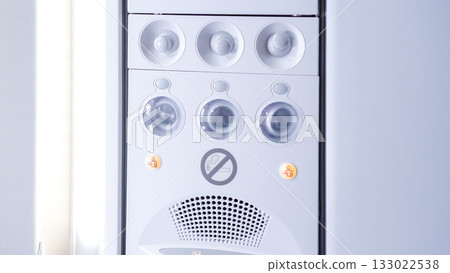 Modern white air conditioning unit with control panel and indicator lights, showcasing sleek design and functionality for indoor climate control Modern white air conditioning unit with control panel and indicator lights, showcasing sleek design and functionality for indoor climate control 133022538