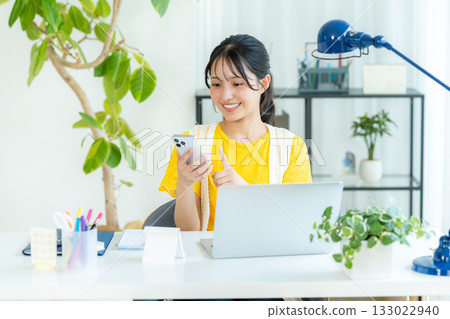 Young woman looking at a smartphone 133022940