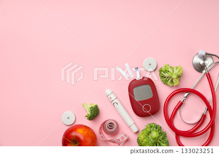 Medical tools and healthy foods on a pink backdrop Medical tools and healthy foods on a pink backdrop 133023251