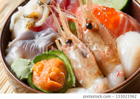 Bowl of rice topped with sashimi Bowl of rice topped with sashimi 133023362