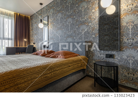 Cozy Modern Bedroom with Gray Headboard and Soft Lighting 133023423