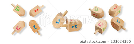Colorful dreidels spinning on white background, isolated, PNG 133024390