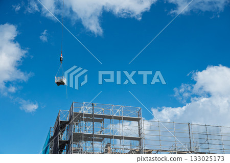 Construction site and lifting work under blue sky 133025173