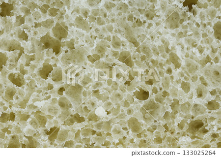 Detailed view of soft bread with bubbles and texture. Detailed view of soft bread with bubbles and texture. 133025264