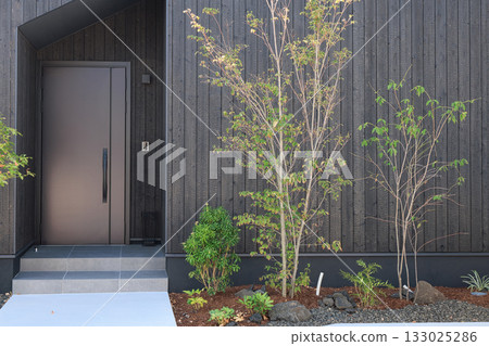 Residential image: Newly built house with charred cedar plank wall entrance Residential image: Newly built house with charred cedar plank wall entrance 133025286
