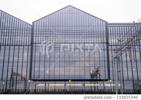 architectural background, glass facade of a modern office building architectural background, glass facade of a modern office building 133025340