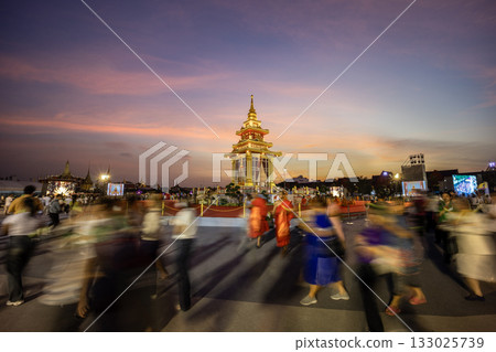 Buddha Tooth Relic Temple and Museum at Sanam Luang with the grand palace in the background during twilgiht time. Buddha Tooth Relic Temple and Museum at Sanam Luang with the grand palace in the background during twilgiht time. 133025739