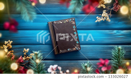 Memories Book Decorated for Christmas on Blue Wooden Background 133026027